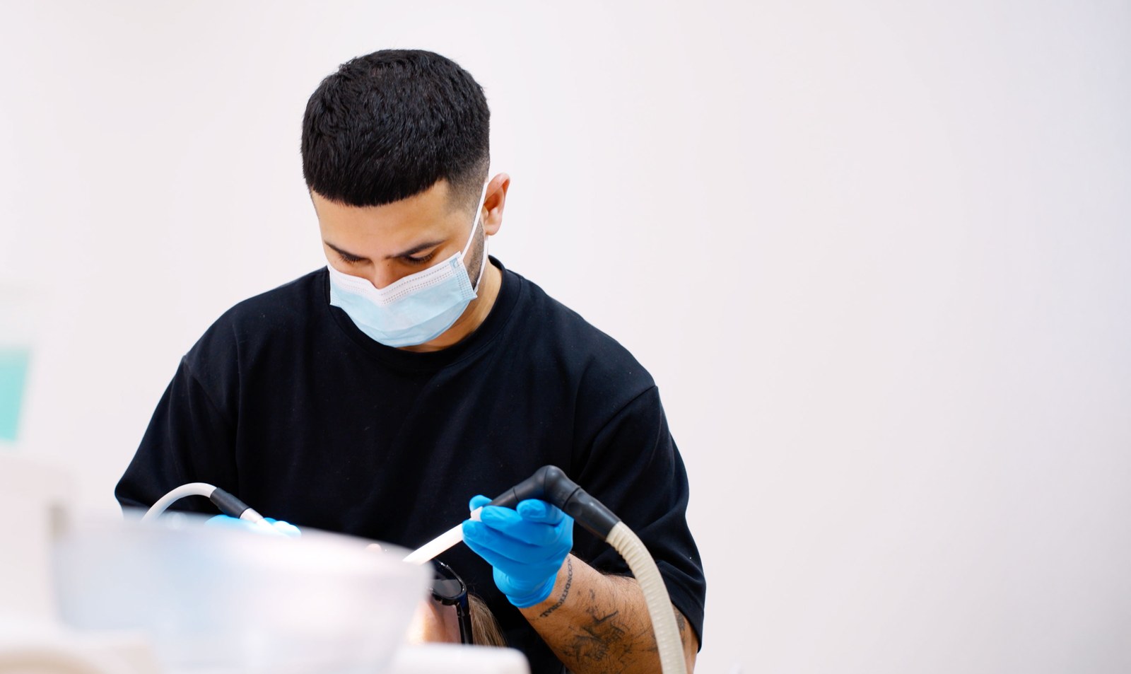 Teki working chairside on a composite bonding case